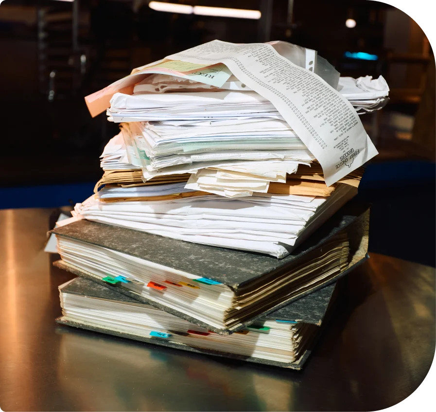 Accountant's desk full of paper folders