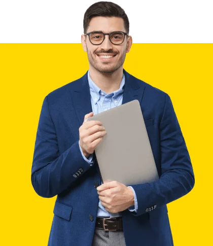 Smart dressed man with glasses holding a laptop